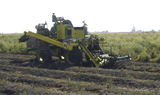 Full-air brussed harvester machine